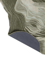 Abstract curve woolen hand-tufted rug with textured waves in earthy green and beige tones