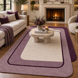 Purple and cream 9x12 rectangular area rug in a modern living room with geometric framed design