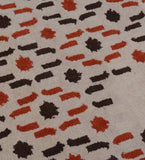 Luxury hand-tufted rug with cascading beige and orange pattern