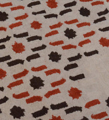 Luxury hand-tufted rug with cascading beige and orange pattern