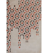 Beige and orange hand-tufted wool rug with cascading dot design