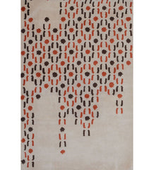 Beige and orange hand-tufted wool rug with cascading dot design