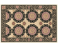 Handcrafted wool Medallion Rug featuring black border and ornate circles.