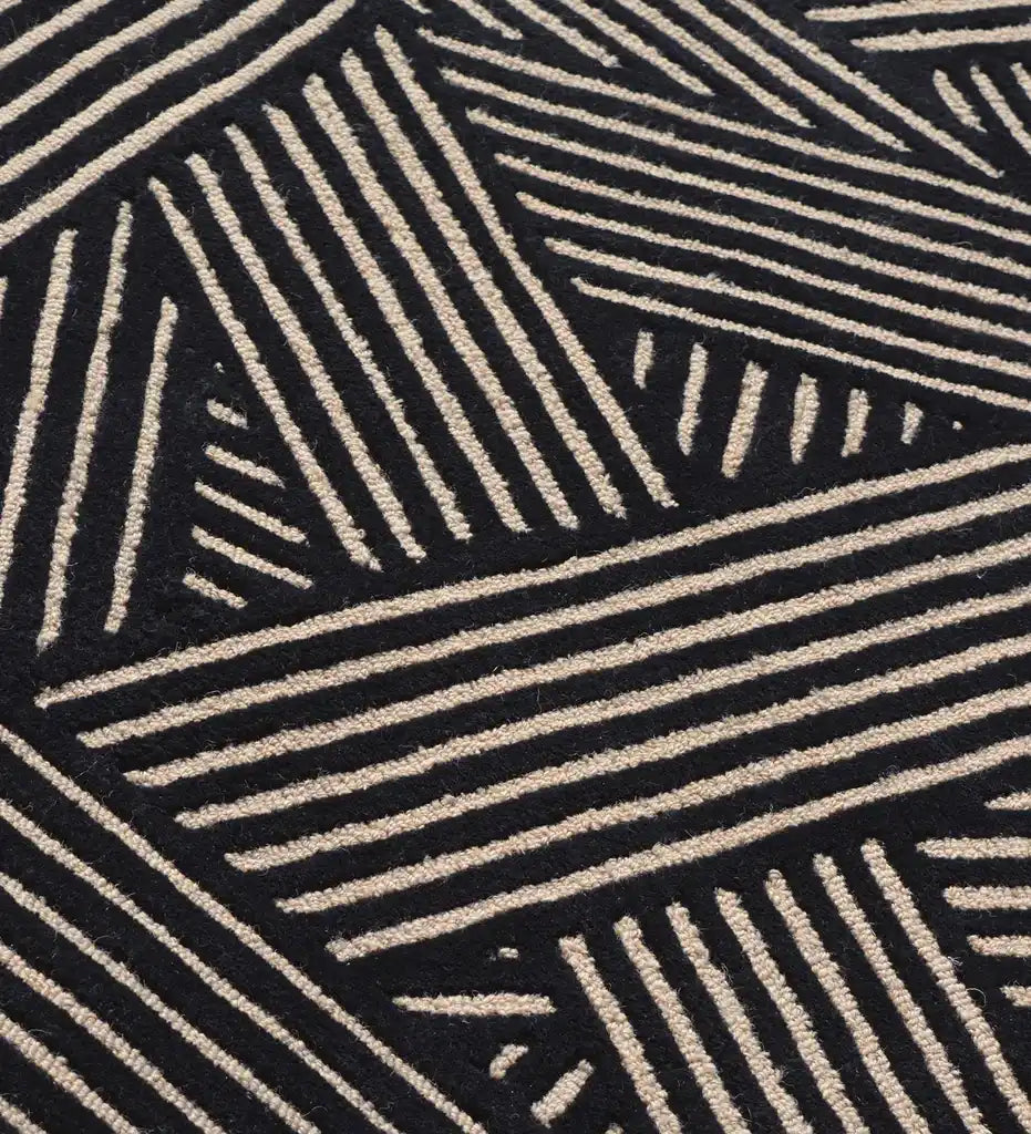 Modern black wool rug with beige linear weave pattern.
