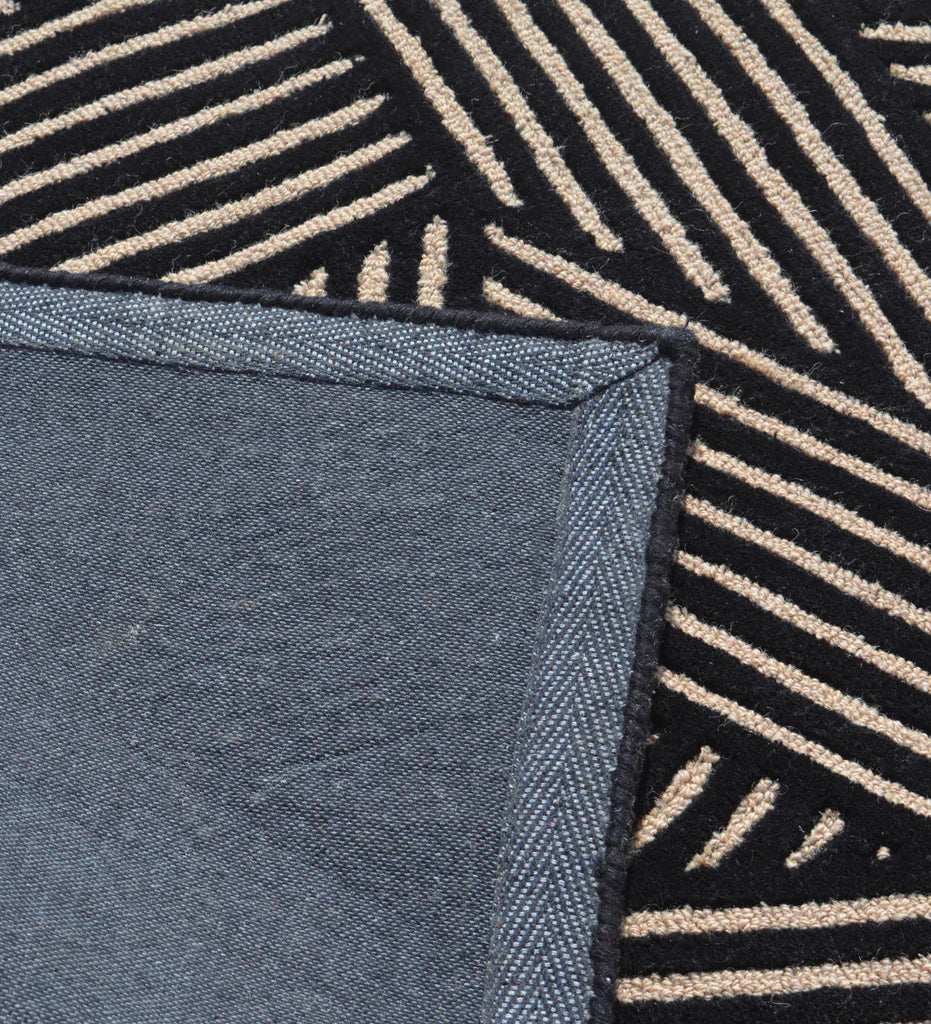 Designer hand-tufted area rug with abstract beige line detailing.
