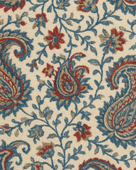Hand-tufted wool rug with beige background and blue paisley design.