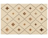 Boho geometric wool rug with beige and tan diamond pattern.