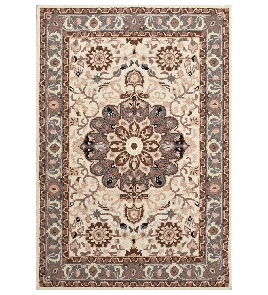 Beige and brown traditional rug with a central floral medallion and intricate border pattern