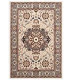 Beige and brown traditional rug with a central floral medallion and intricate border pattern
