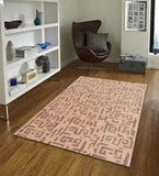Beige and brown modern tribal patterned rug on wood floor in contemporary living room