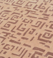 Beige and brown modern tribal rug with geometric abstract pattern