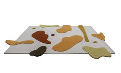 Premium hand-tufted wool rug with organic pattern.