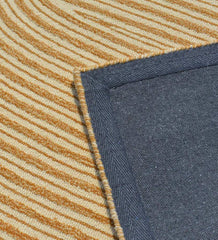 Beige and brown abstract wool rug with flowing curved design