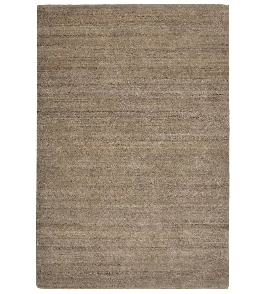 Minimalist beige hand-tufted wool rug with linear texture