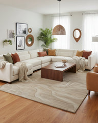Beige and taupe sand dune waves textured area rug with a hand-tufted finish, featuring soft flowing patterns that add a calm to your living space