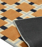 Luxury wool rug featuring terracotta and navy geometric design