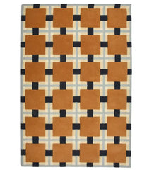 Hand-tufted wool rug with terracotta squares and navy grid design