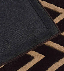 Close-up of beige and brown hand-tufted runner rug edge with zigzag pattern and sturdy backing by Mannat Rugs