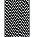 Black and white handwoven wool rug with bold tufted chevron pattern by Mannat Rugs
