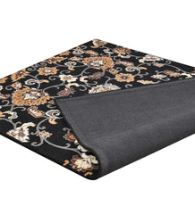 Heritage-inspired wool rug with ornate floral vine design