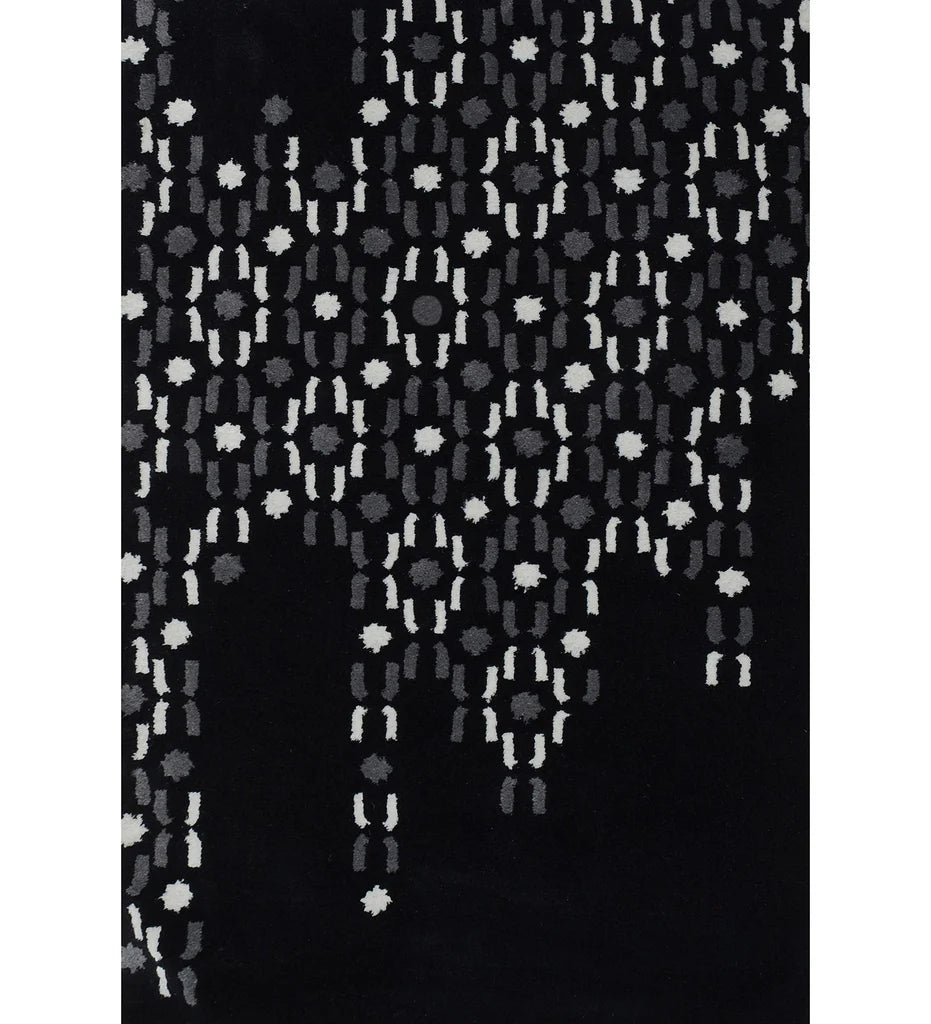 Abstract black hand-tufted wool rug with grey and white dot pattern