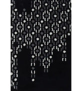 Abstract black hand-tufted wool rug with grey and white dot pattern