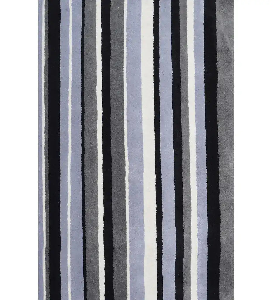 Black, gray, and blue hand-tufted wool rug with vertical striped pattern.