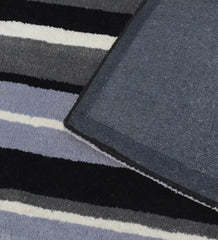 Elegant black and blue striped rug for modern living rooms.