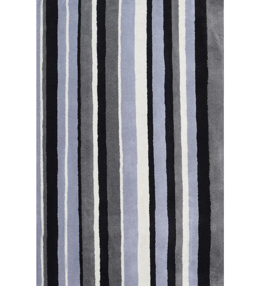 Black, gray, and blue hand-tufted wool rug with vertical striped pattern.
