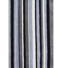 Black, gray, and blue hand-tufted wool rug with vertical striped pattern.