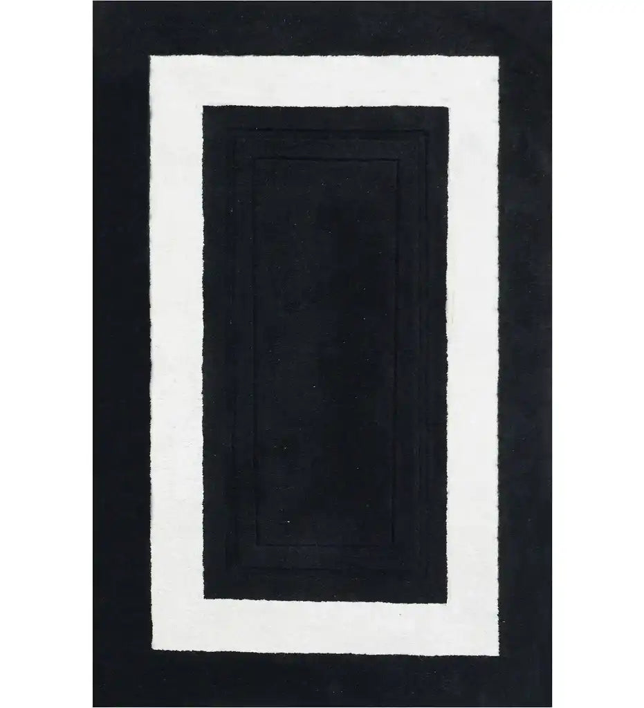 Black hand-tufted solid wool rug with white rectangular border, modern luxury design
