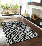 Modern monochrome artisan rug featuring maze-inspired design