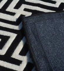 Contemporary black and white rug with bold maze pattern