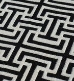 Luxury hand-tufted wool rug in black and white geometric style