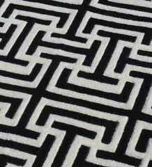 Luxury hand-tufted wool rug in black and white geometric style