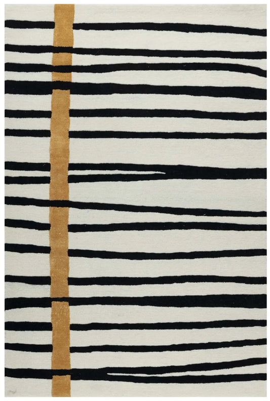 Modern striped hand-tufted wool rug in black and white with golden accent.