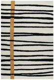 Modern black and white striped rug with vertical golden accent lines and abstract pattern