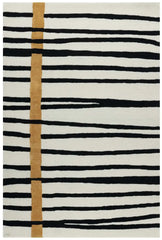 Modern black and white striped rug with vertical golden accent lines and abstract pattern