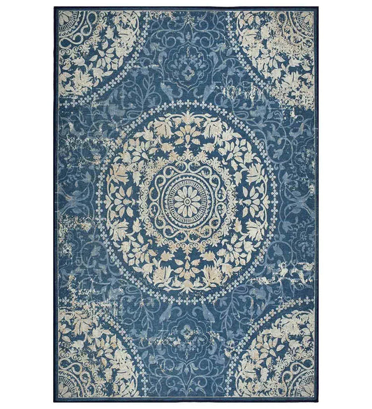 Blue vintage medallion rug with distressed detailing.
