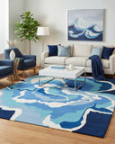 Blue coastal hand-tufted area rug styled in a living room, bringing a calm, airy, and relaxed seaside-inspired accent to the space