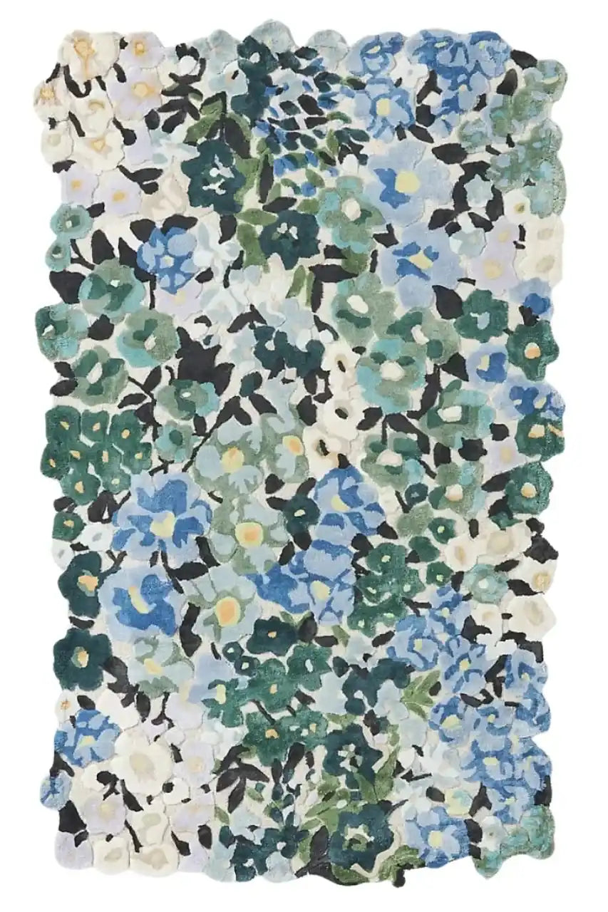 Handwoven luxury floral rug with blue, green, and white wild meadow flowers, irregular edges