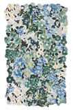 Handwoven luxury floral rug with blue, green, and white wild meadow flowers, irregular edges