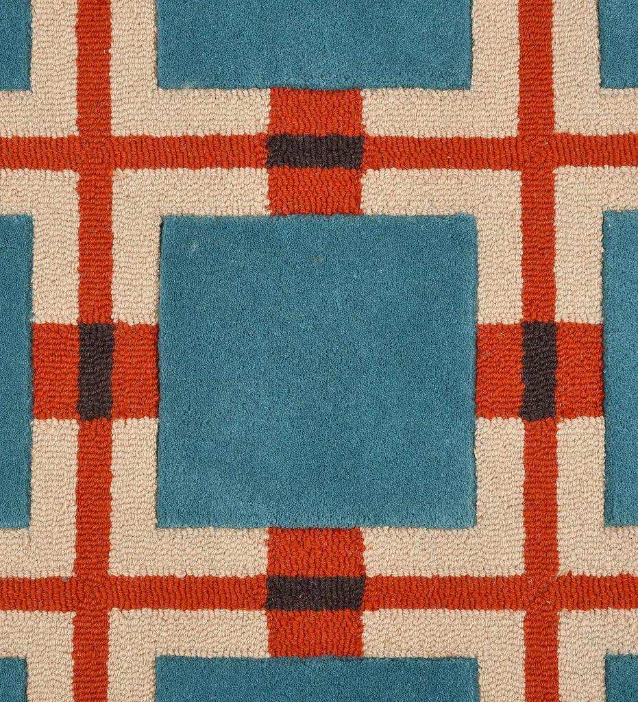 Blue and red retro geometric grid rug with cream and black accents