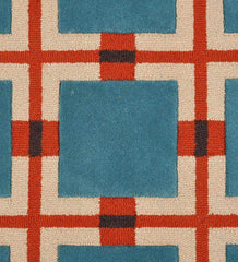 Blue and red retro geometric grid rug with cream and black accents