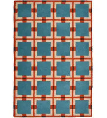 Blue and red retro geometric rug with square grid pattern on cream background