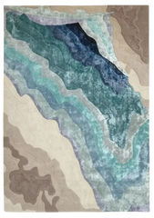 Abstract blue and cream hand-tufted wool rug with layered, wavy patterns and textured design