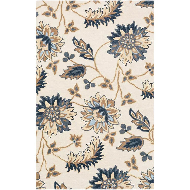 Hand-tufted luxury rug with blue and beige floral pattern on cream background