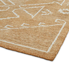 Handcrafted bohemian rug with geometric tribal artwork.