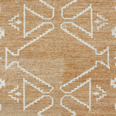 Tribal design wool rug in beige and white for boho interiors.