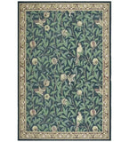 Luxury botanical rug with green leaves, pomegranate fruits, and birds on deep blue background, decorative border